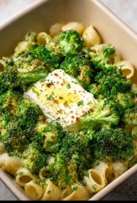 Baked feta pasta with broccoli dish served in a bowl