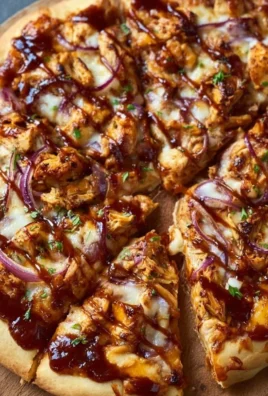 BBQ chicken pizza topped with chicken, barbecue sauce, and melted cheese.
