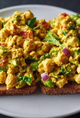 Delicious curried chickpea salad with fresh vegetables and spices