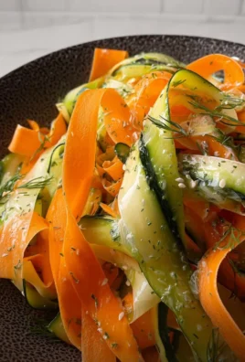 Fresh Carrot and Cucumber Ribbon Salad served in a bowl