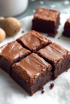 Delicious chocolate ganache brownies topped with smooth ganache frosting.