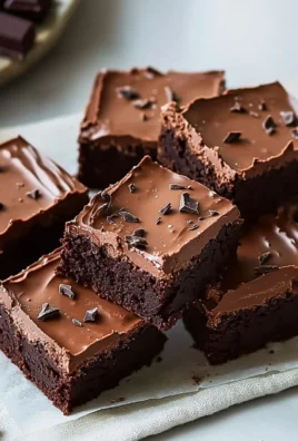Delicious Chocolate Mousse Brownies topped with creamy mousse layer and chocolate drizzle.