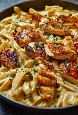 Creamy Cajun chicken pasta dish with vibrant colors and rich sauce