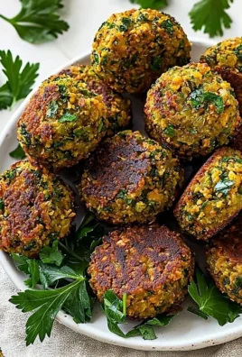 Plate of crispy, golden brown homemade falafel served with dipping sauce.