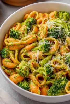 Plate of easy healthy broccoli pasta topped with parmesan cheese