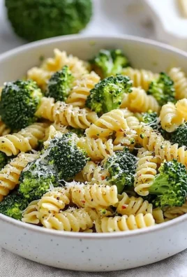 Delicious easy healthy broccoli pasta dish garnished with parmesan cheese.