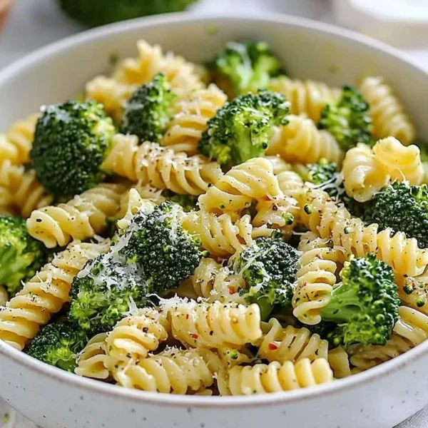 Delicious easy healthy broccoli pasta dish garnished with parmesan cheese.