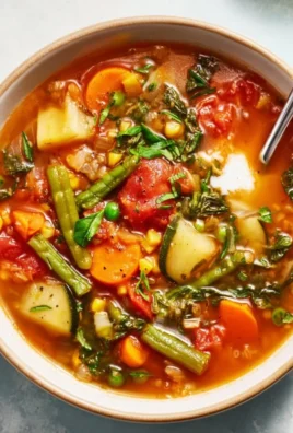 Bowl of easy vegetable soup with colorful mixed vegetables