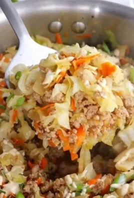 Delicious egg roll in a bowl filled with fresh vegetables and savory meat