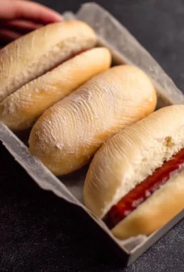 Gluten free hot dog bun recipe with ingredients and baked buns on a plate.
