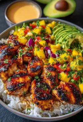 Grilled Maple Sriracha Chicken Bites served with coconut rice and mango avocado salsa
