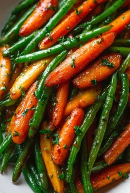 Honey glazed carrots served with green beans on a plate