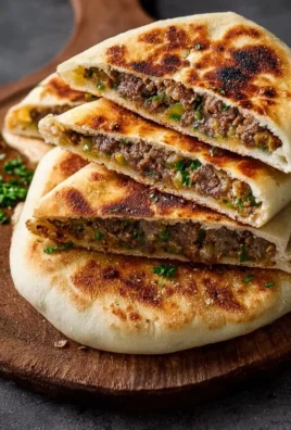 Lebanese stuffed pita arayes with spiced meat and crispy pita bread
