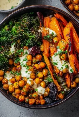 One-pan roasted carrot and chickpea bowl served in a vibrant dish.