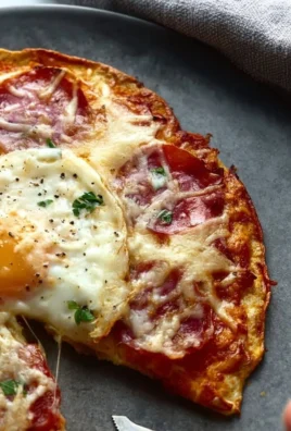 Delicious Pizza Eggs served on a plate with fresh toppings.