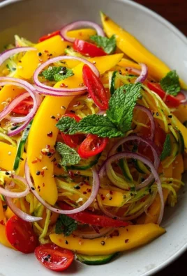 Delicious refreshing mango salad with lime dressing served in a bowl