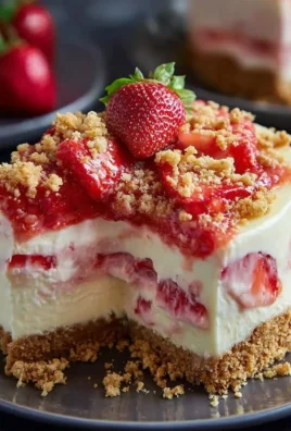 Delicious Strawberry Crunch Cheesecake with creamy layers and a crunchy topping