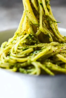 Bowl of creamy avocado pasta sauce with fresh ingredients