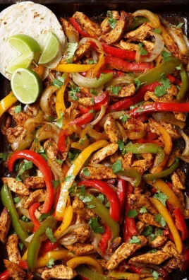 Delicious baked chicken fajitas served with colorful peppers and onions