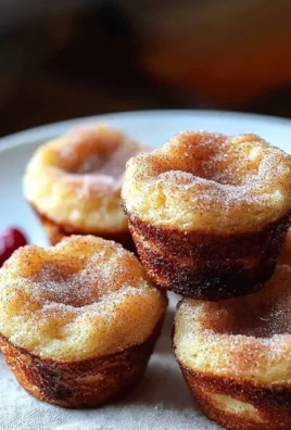 Cinnamon Sugar French Toast Muffins served on a plate with syrup