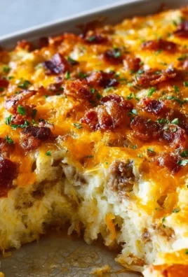 Classic Breakfast Hashbrown Casserole served in a dish with melted cheese on top
