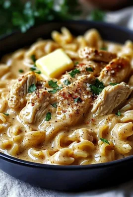 Creamy cowboy butter chicken pasta served in a bowl with herbs and spices