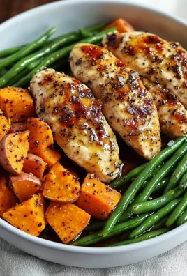 Delicious honey garlic chicken served with roasted sweet potatoes on a plate