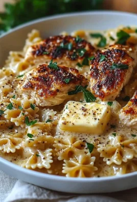 Delicious Garlic Butter Chicken served with bowtie pasta, a comforting meal.