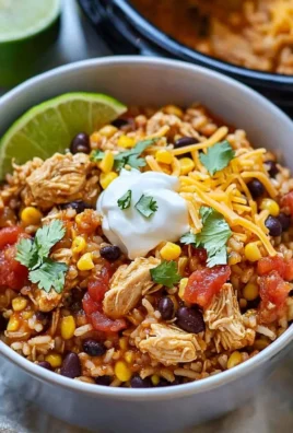 Instant Pot chicken burrito bowls topped with fresh ingredients in a bowl.