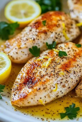 Plate of Lemon Pepper Chicken Breast garnished with herbs