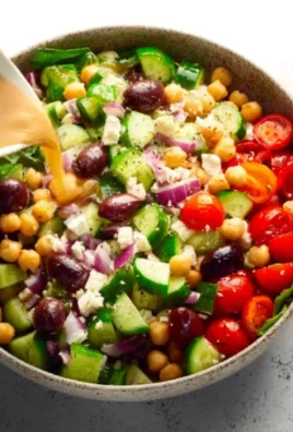 Colorful Mediterranean chopped salad with fresh vegetables and herbs