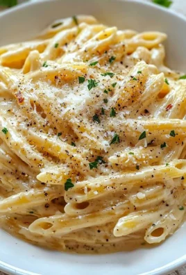 One pot creamy garlic pasta with fresh herbs and garlic in a bowl