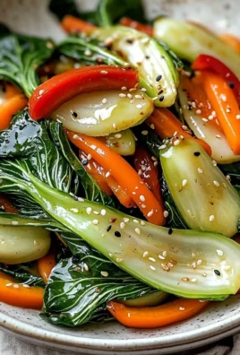 Sautéed Bok Choy with carrots and peppers in a skillet