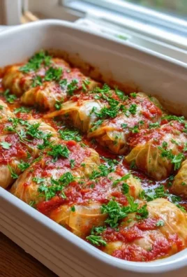 Delicious beef stuffed cabbage rolls served on a plate with sauce