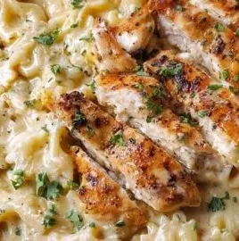 Creamy garlic parmesan chicken served with pasta on a plate