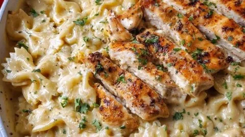 Creamy garlic parmesan chicken served with pasta on a plate