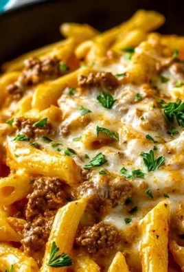 Creamy high protein beef pasta dish with herbs and parmesan cheese