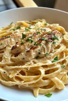 Creamy Fettucine Alfredo Pasta served with parsley garnish