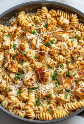 Healthy garlic parmesan chicken pasta in a bowl ready to serve.