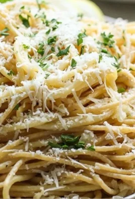 Plate of Lemon Garlic Parmesan Pasta garnished with parsley and lemon slices