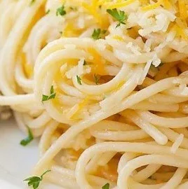 Delicious Parmesan Garlic Noodles served in a bowl with fresh herbs