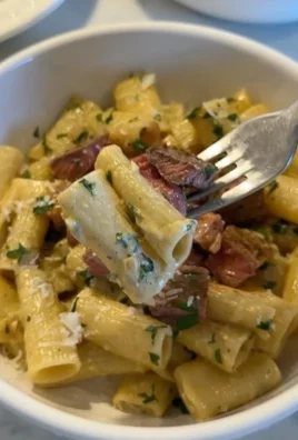 Delicious Steak Pasta in Creamy Garlic Parmesan Sauce served on a plate