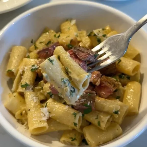 Delicious Steak Pasta in Creamy Garlic Parmesan Sauce served on a plate
