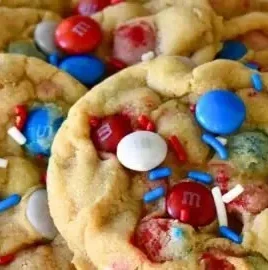 Colorful 4th of July cookies decorated with red, white, and blue icing.