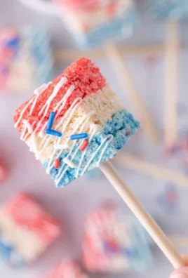 4th of July themed Rice Krispie Treats decorated with stars and stripes