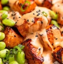 Delicious air fryer salmon bites served with dipping sauce.