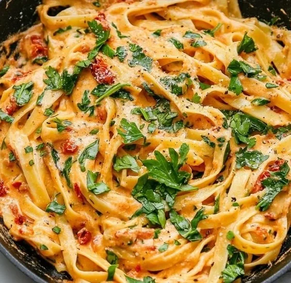 Creamy vegan sun-dried tomato pasta dish served in a bowl