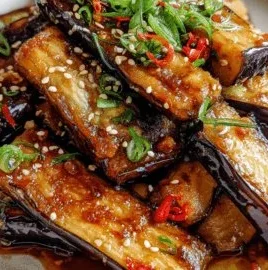 Crispy eggplant in garlic soy glaze served in a bowl