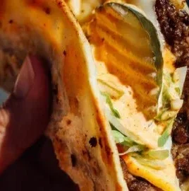 Easy Smash Burger Tacos served on a plate with toppings