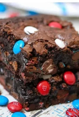 Delicious fudgy gooey brownies fresh out of the oven, topped with chocolate chips.